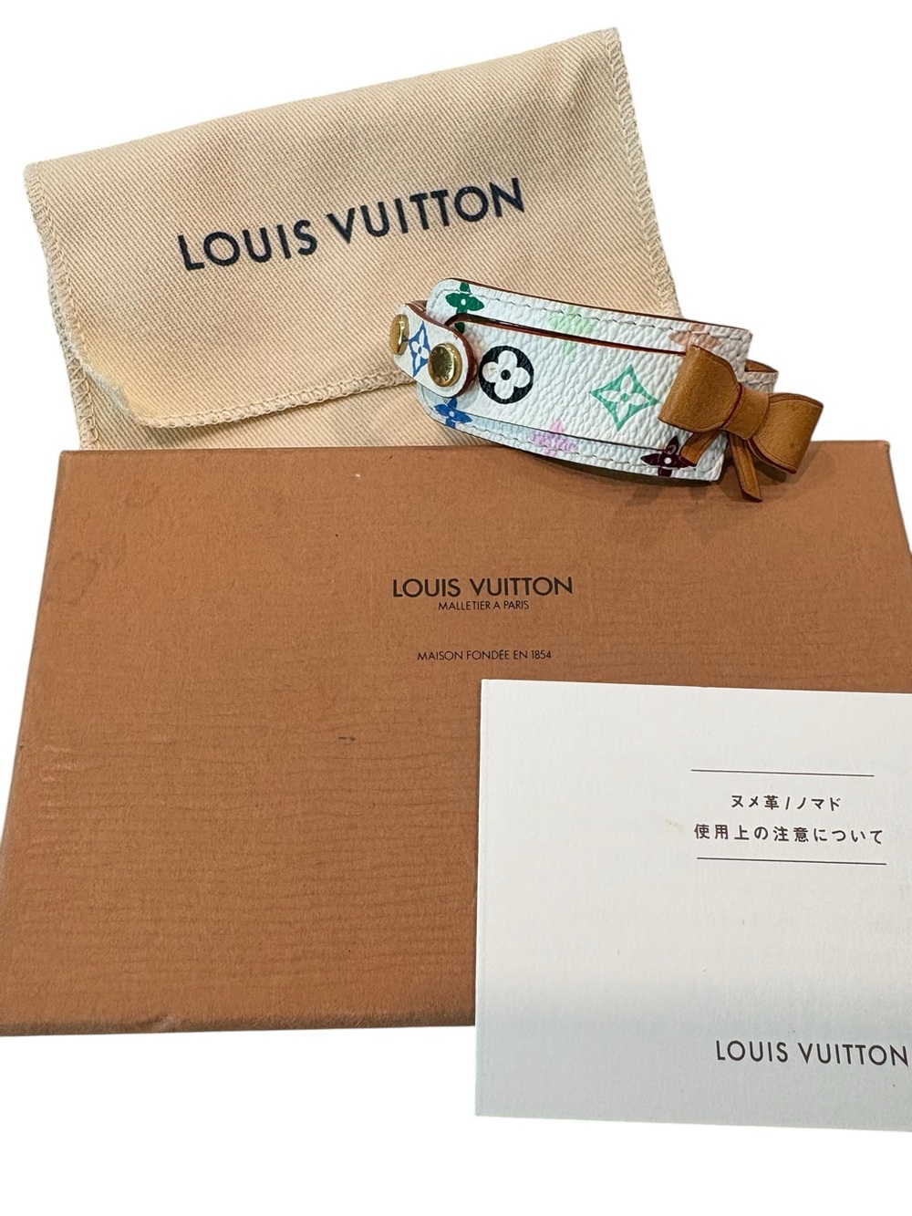Louis Vuitton Multicolor Monogram White Leather Bracelet with Bow Accent